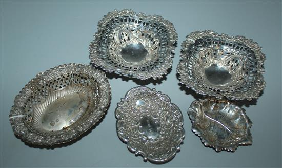 Pair of embossed and pierced silver bon bon dishes & three other small silver dishes, various (5)